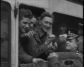 British Soldiers Receiving Food and Drink on the Train Back To Camp, 1940. Creator: British Pathe Ltd.