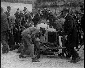 A Group of Male Civilians Working on a Car, 1924. Creator: British Pathe Ltd.