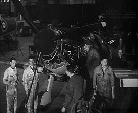 Factory Workers Inspecting a Spitfire Under Construction, 1940. Creator: British Pathe Ltd.