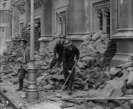 British Air Raid Wardens Clearing up Rubble Around the Palace of Westminster, 1941. Creator: British Pathe Ltd.