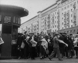 Civilians with newspapers in the Streets of Moscow, 1941.  Creator: British Pathe Ltd.