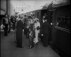 King George VI and Queen Elizabeth of Britain Being Greeted in Paris at Bois de Boulogne..., 1938. Creator: British Pathe Ltd.