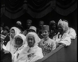 Dignitaries and Representatives from Various African Countries Sitting in Raked Seats at a..., 1939. Creator: British Pathe Ltd.