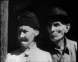 Faces of an Elderly Couple As They Watch a Train Arriving at a Station, 1932. Creator: British Pathe Ltd.