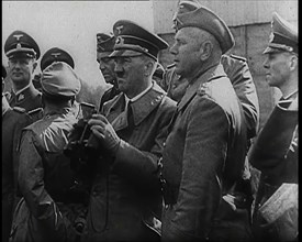 Adolf Hitler Holding a Pair of Binoculars and Standing With a Group of German Military Officers,1939 Creator: British Pathe Ltd.