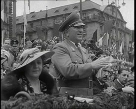 Close up of a German Nazi Party Official in a VIP Section of a Stand With Others Clapping..., 1938. Creator: British Pathe Ltd.