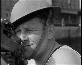 British Sailors Mounting Machine Guns To Small Boats for the Dunkirk Evacuation, 1940. Creator: British Pathe Ltd.