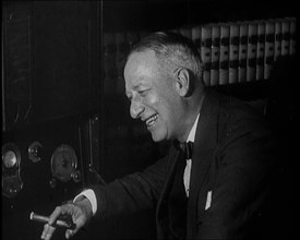 Al Smith, Former Presidential Candidate, Smoking a Cigar And Following Election Results..., 1932. Creator: British Pathe Ltd.