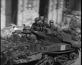 British Expeditionary Force Retreating Through Belgian Town on Vehicles, 1940. Creator: British Pathe Ltd.