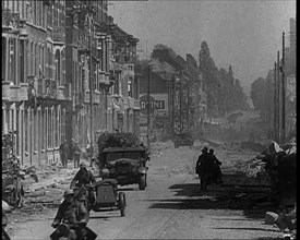 British Expeditionary Force Retreating Through Belgian Town on Vehicles, 1940. Creator: British Pathe Ltd.