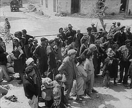 Italian Civilians in a Bomb-Damaged Italian Town, 1943-1944. Creator: British Pathe Ltd.