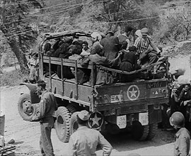 Italian Civilians Being Driven off in a US Army Truck, 1943-1944. Creator: British Pathe Ltd.