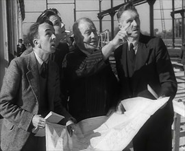 American Engineers Going Over Construction Plans of a Hangar at an Airfield in England, 1943-1944. Creator: British Pathe Ltd.