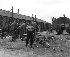 American Airmen Queueing up Outside a Building at an Airfield in England, 1943-1944. Creator: British Pathe Ltd.