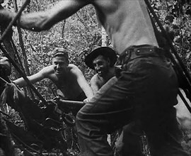 Australian Troops Organising Ropes to Transport Supplies, 1943. Creator: British Pathe Ltd.