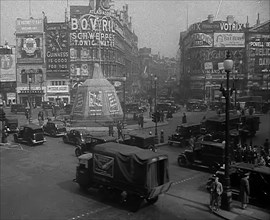 People and Traffic Moving Through a Busy Junction in London, 1943. Creator: British Pathe Ltd.