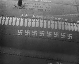 Swastika and Bomb Images Painted on the Fuselage of a Bomber Aircraft, 1943-1944. Creator: British Pathe Ltd.