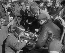 American Airmen Sitting and Eating in an Airfield, 1943-1944. Creator: British Pathe Ltd.