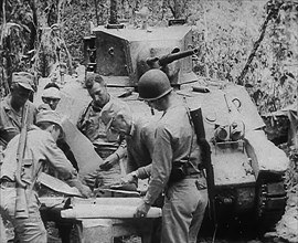 Commonwealth Troops Planning Next to a Tank, 1943. Creator: British Pathe Ltd.