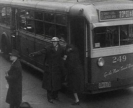 An Air Raid Warden Directing Civilians, 1942. Creator: British Pathe Ltd.