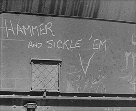 The Words: 'Hammer and Sickle ‘Em’ Written on Some Cargo, 1943. Creator: British Pathe Ltd.