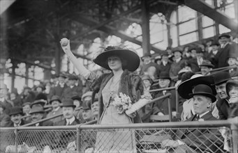 Miss Genevieve Ebbets, youngest daughter of Charley Ebbets, throws first ball at opening..., 1913. Creator: Bain News Service.