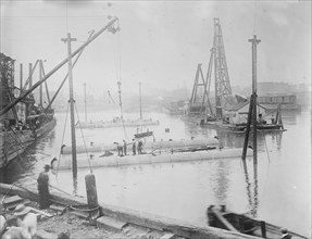 Tubes for subway line under Harlem River, being sunk, between c1910 and c1915. Creator: Bain News Service.