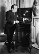 Enrico Caruso with phonograph, 1918 and c1920. Creator: Bain News Service.