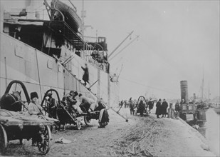 Unloading SEATTLE, Archangel, between c1915 and c1920. Creator: Bain News Service.