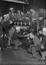 Assembling main engine, between c1915 and c1920. Creator: Bain News Service.