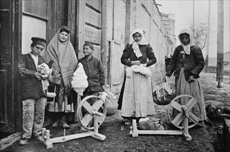 Erivan : Taking home spinning wheels & cotton, between c1915 and c1920. Creator: Bain News Service.