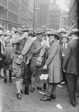 Emma Rencken "watering" soldiers, between c1915 and c1920. Creator: Bain News Service.