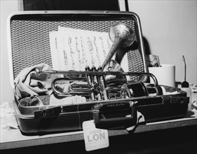 Dizzy Gillespie, trumpet in case, Manchester, 1963. Creator: Brian Foskett.