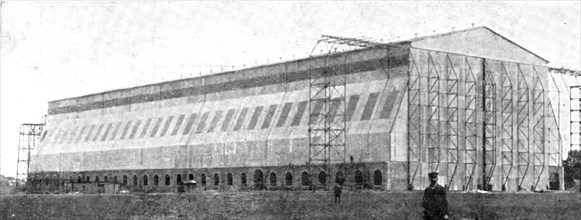 The Home Of "Zeppelin I": The Newly Built Air-Ship Shed..., Near Metz, 1909.  Creator: Reclam.