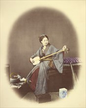 Girl Playing the Samisen, 1866-1867. Creator: Felice Beato.