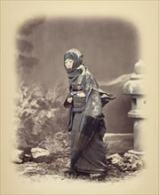 Woman in Winter Dress, about 1868. Creator: Felice Beato.