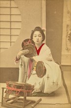 Girl Beating a Tsuzumi, 1897. Creator: Ogawa Kazumasa.