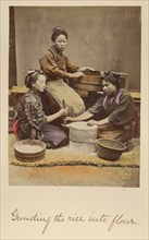 Grinding the rice into flour, about 1873-1883. Creator: Shinichi Suzuki I.