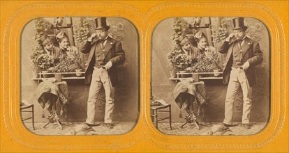 Well-dressed man in top hat twirling his moustache, two women gazing at him through..., 1855-1860. Creator: Unknown.