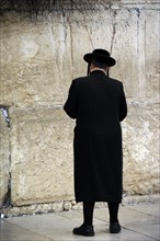 A Jew praying at the Western Wall, Jerusalem, Israel, 2013.  Creator: LTL.