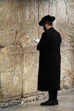 A Jew praying at the Western Wall, Jerusalem, Israel, 2013.  Creator: LTL.