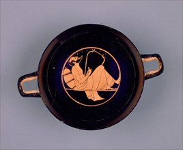 Attic Red-Figure Cup; Wine Cup with a Singing Reveler; Paleothodoros, Dimitris..., about 510 B. C. Creator: Epiktetos.