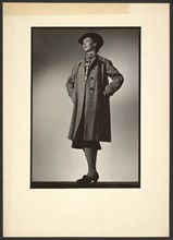 Woman modeling coat, early 1940s. Creator: Gunther Krampf.