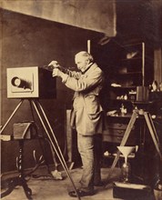 Self-portrait preparing a Collodion plate, 1856-1859. Creator: Horatio Ross.