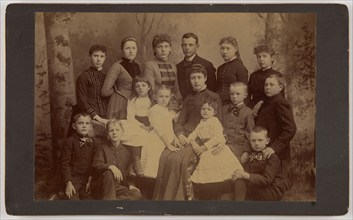 Group family portrait of fifteen people, 1870s. Creator: Unknown.