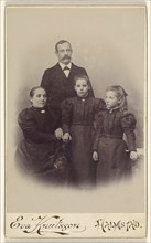 Family portrait: mother, father, and two daughters, 1895-1912. Creator: Eva Knutsson.