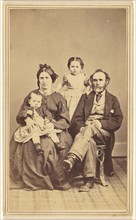 Family portrait: mother, father and two children, 1870s. Creator: BF Green.