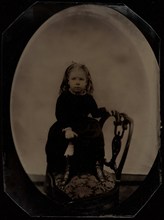 Portrait of a Little Girl Standing on a Chair, 1870s. Creator: Unknown.