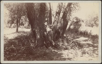 F.A. Williams resting against a tree, 1892. Creator: Unknown.