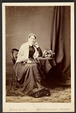 Portrait of seated woman, about 1879-1885. Creator: Maull & Fox.